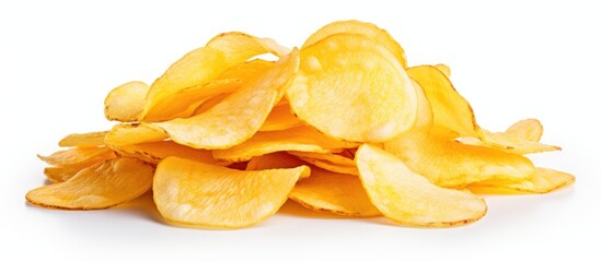 A pile of potato chips, a popular junk food snack, is displayed on a white background. This staple...