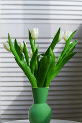 Bouquet of white tulips on a light background. - 756002948