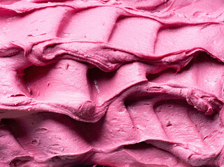 Frozen Pomegranate flavour gelato - full frame detail. Close up of a pink surface texture of Ice cream.