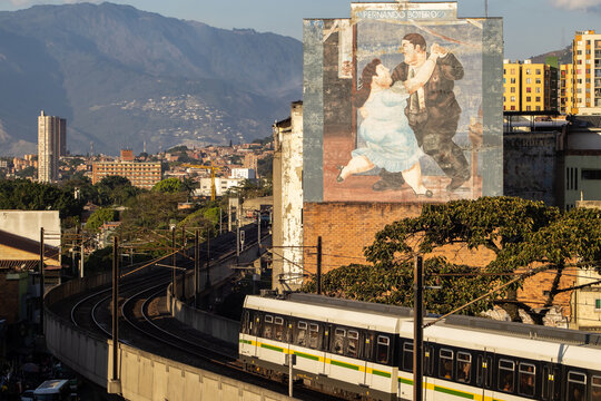MEDELLIN, COLOMBIA - JANUARY 17, 2024: View  the of the Metro and a reproduction of a painting by Fernando Botero in Medellin.