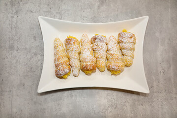 Top view of custard cream filled horns or cones.