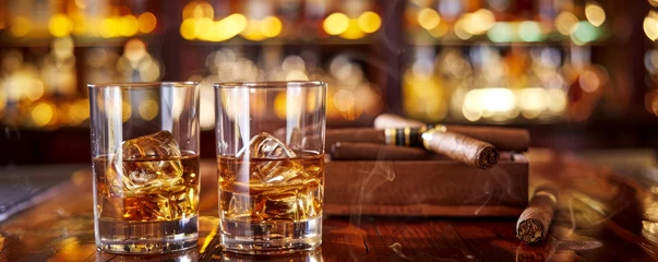  a glass of strong whiskey with ice and cigars stand on a wooden bar counter against the background of the bar © MK studio