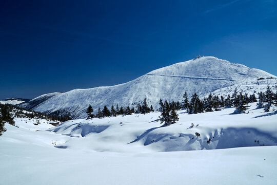 tourist shelter on the snow-covered peak of Sniezka in the Karkonosze Mountains