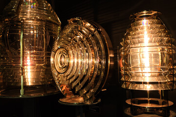 Close view of different Fresnel lens for lighthouses, lights on in