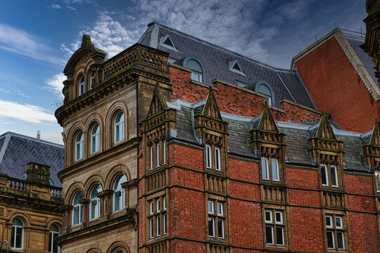 Victorian architecture with ornate details and blue sky in Leeds, UK.