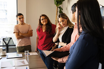 Plus size businesswoman paying attention during a team meeting