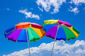Two rainbow colored beach umbrellas against the blue sky Generative AI
