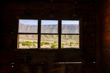 Ballarat Ghost Town. Abandoned houses, rusty cars, and desert views.