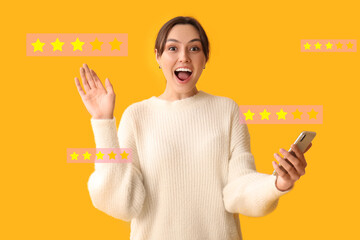 Beautiful woman with mobile phone waving hand on yellow background