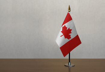 Canada table flag on gray blurred background