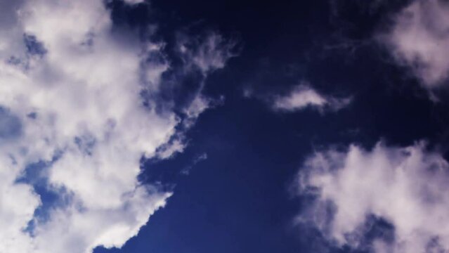 Air plane window view time lapse clouds and blue sunny sky, Loop of white clouds over blue sky with sun Rays, Aerial view, drone shooting clouds motion time, nature blue sky a white cleat weather. 4K.
