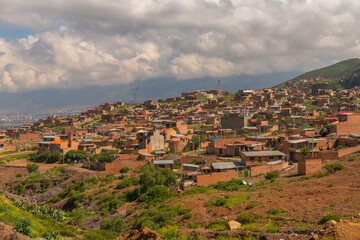Fototapeta na wymiar aerial view of social problems, overpopulation in latin america, houses built on hills, mountains,