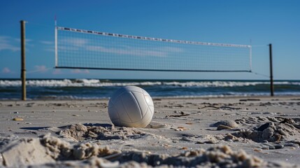 beach volleyball. a volleyball ball on a beach with a volleyball net in the background. beach sports and recreational activities