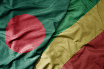 big waving national colorful flag of republic of the congo and national flag of bangladesh.