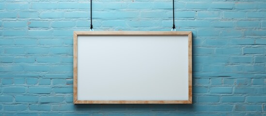 Aqua rectangle whiteboard with a wooden frame is symmetrically hung on an azure blue brick wall. Electric blue water tints and shades create a harmonious contrast with the circle font design