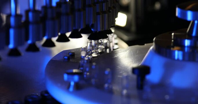 vaccine filling process drug vial in a medicine factory creative view of small vials collected for manufacturing small glass injection moving in a pharma equipment machinery pharmaceutical industry	