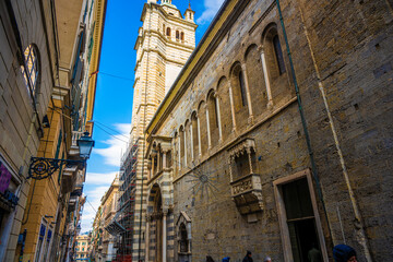 Obraz premium Medieval Stone Architecture and Bell Tower in Genoa's Historic Alley