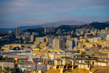 Fototapeta premium Winter Morning View of Genoa with Snow-Capped Mountains in the Background