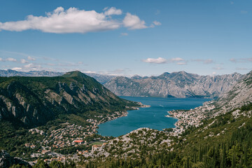 Fototapeta na wymiar Bay of Kotor in the valley among the mountain range. Montenegro. Drone