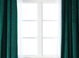 Stylish green curtains on window in living room