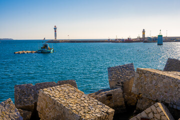 Calm Waters of Cannes Harbor with Iconic Lighthouse in the Background, France