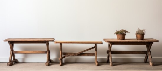 Vintage wooden tables against a white backdrop.