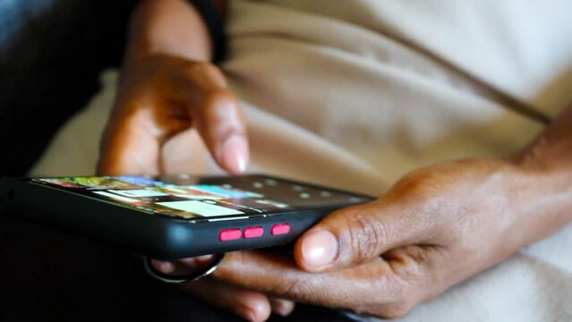 Female hand fingers scrolling phone screen and browsing online social media 2