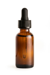 Essential serum oil in amber bottle isolated on white background.