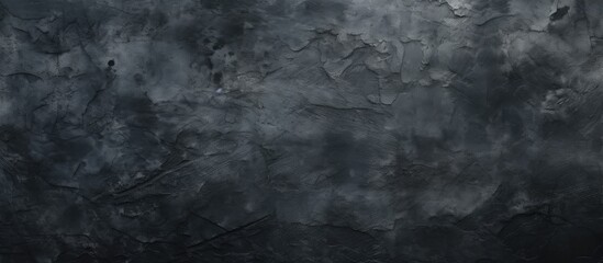 Obraz premium Grey smoke billows out of a hole in the ground on a monochrome background. The darkness enhances the pattern of the smoke, creating a striking monochrome photo