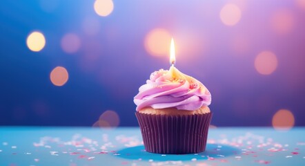 Colorful  birthday cupcake with single candle on blurred background. Festive dessert for holiday...