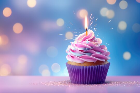 Colorful  birthday cupcake with single candle on blurred background. Festive dessert for holiday party. Baby shower, weeding, Valentine's or Women's day. Greeting card or banner with copy space