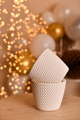 White decorative plastic flower pots with a knitted pattern design.