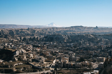 Aerial view of Cappadocia city with Snowy Erciyes Mount, Turkey