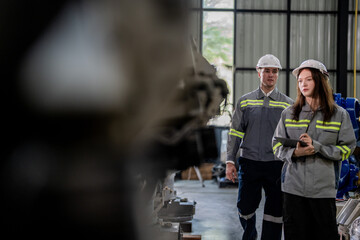 engineers check control heavy machine robot arm. Diverse Team of Industrial Robotics Engineers Gathered Around Machine. Professional Machinery Operators repair electric robot on bright digital panel.
