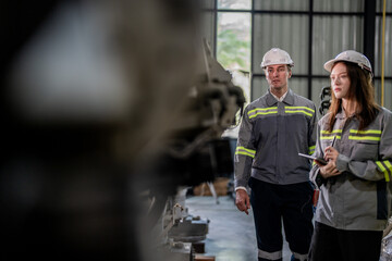 engineers check control heavy machine robot arm. Diverse Team of Industrial Robotics Engineers Gathered Around Machine. Professional Machinery Operators repair electric robot on bright digital panel.