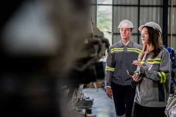 engineers check control heavy machine robot arm. Diverse Team of Industrial Robotics Engineers Gathered Around Machine. Professional Machinery Operators repair electric robot on bright digital panel.