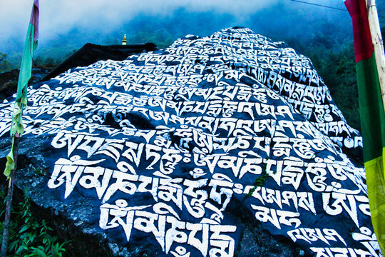 Buddhist Mantra - Om Mani Padme Hum is painted on the rocks along the trekking route to the Everest Base camp from Lukla to Namche Bazaar,Nepal