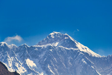Massive West Face and summit pyramid of Mount Everest in this telephoto image taken from Namche...