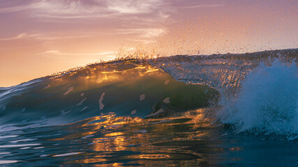 Crashing Wave backlit by sunset