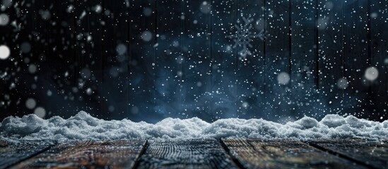 A wooden table stands in a snowy natural landscape, with snow falling gently in the background. The frosty scene combines elements of wood, water, and soil - obrazy, fototapety, plakaty