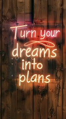 
Warm, glowing letters spell "Turn your dreams into plans" against a rustic wood background. Modern typography inspires action with a touch of rustic charm.