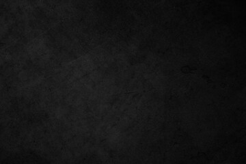 Black dark concrete wall background. Pattern board cement texture grunge dirty scratched for show anthracite promote product urban floor and abstract paper design element decor. Blackboard blank.