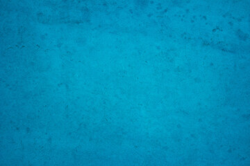 Dark blue concrete stone texture for background in summer wallpaper. Cement and sand wall of tone...