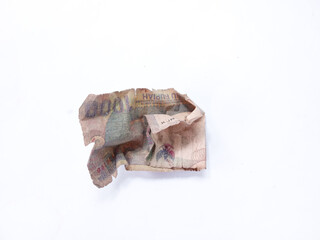 damaged banknotes. Broken thousand rupiah banknotes isolated on white background. torn banknotes. money is not fit for circulation. Indonesian banknotes or rupiah
