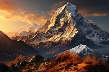 Photo sur Plexiglas Himalaya Snowcovered mountain at sunset with sun shining through clouds
