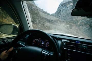  Driving car on the high altitude mountain trail in tibet,China