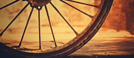 Poster A detailed shot showcasing a bicycle wheel rim with tire placed on a wooden floor, highlighting the intricate design and texture of the bicycle part © 2rogan