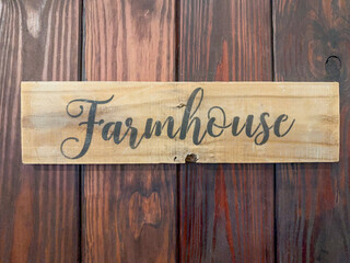 Farmhouse Sign on a Wood Plank on a door 