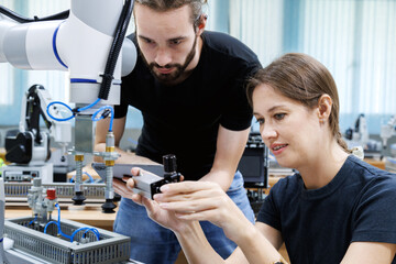 automation machine engineer students study and inspection control robot arm machine in robotics engineering academy at university or factory workshop. AI robot technology, future innovation trend.