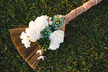 Beautiful traditional broom, Jumping the broom (or jumping the besom) is a phrase and custom relating to a wedding ceremony in which the couple jumps over a broom.